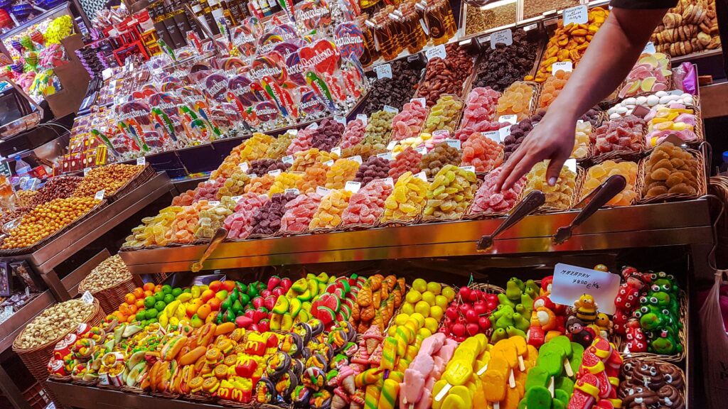 Colorful display of dried fruits, nuts and meats at La Boqueria in Barcelona