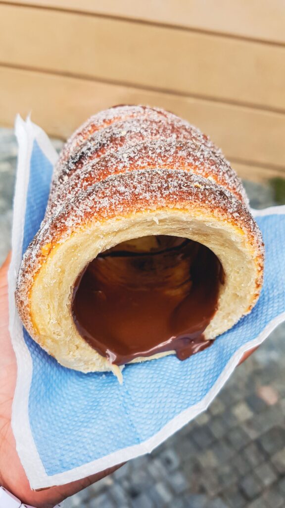 sweet bread dough like pastry stuffed with chocolate filling and dusted in cinnamon and white sugar