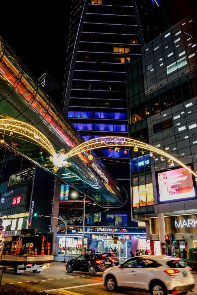 buildings during nighttime and cars on the roads