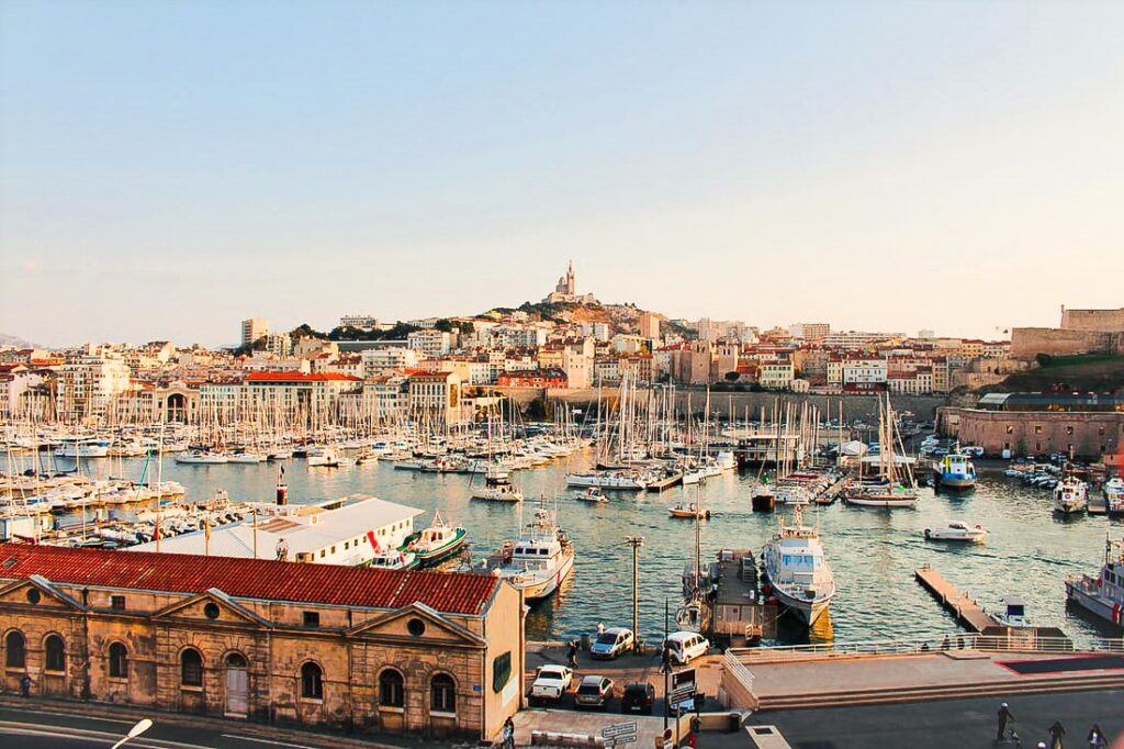 Port with boats and buildings during daytime