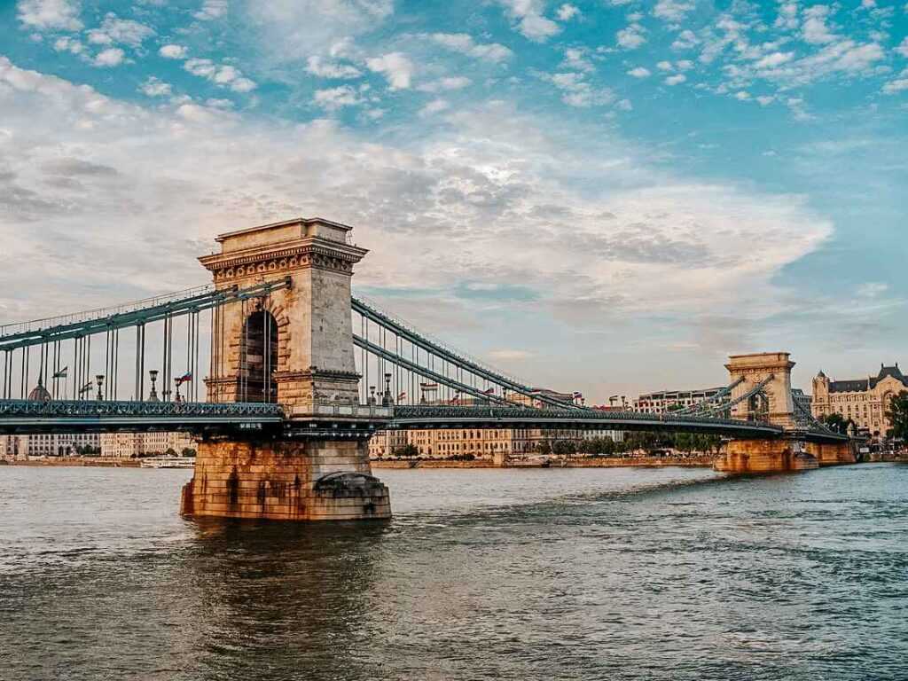 Széchenyi Chain Bridge sitting over  a body of water during day time