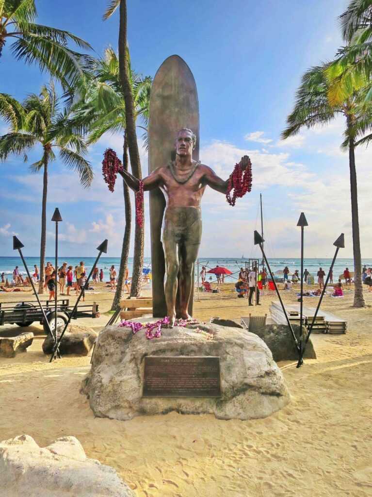 Bronze statue on a beach during daytime