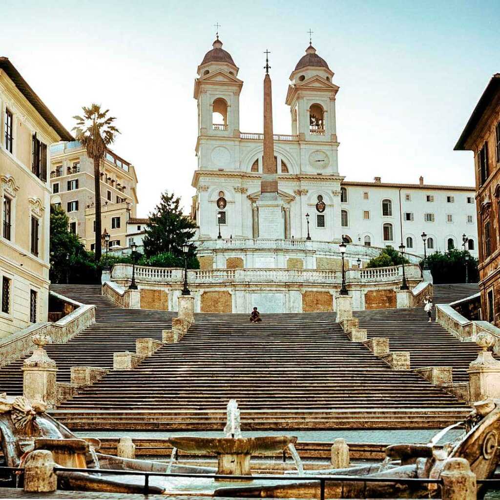 Steps leading up to a white concrete structure during day time. Popular tourist attraction and One of the best places to visit in Rome 