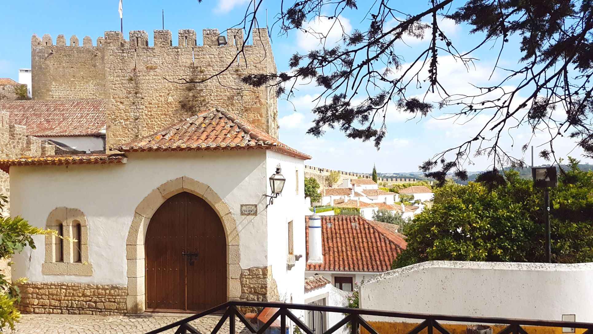 White washed houses and brown stone wall during daytime