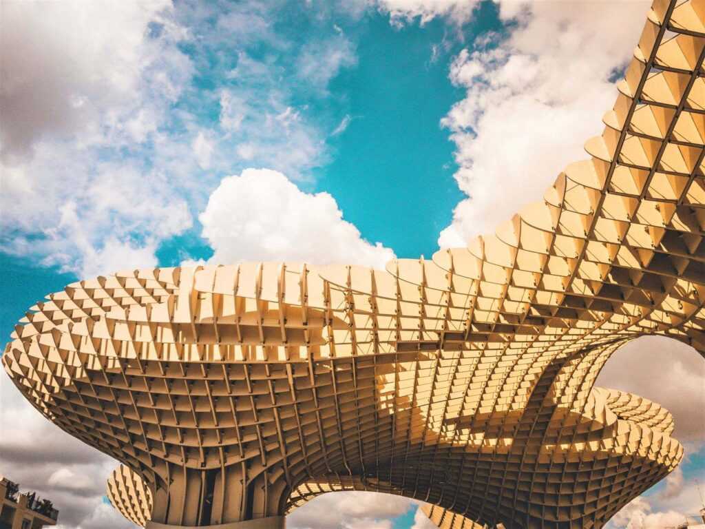 Large white wooden structure during daytime. One of the more popular attractions in Seville