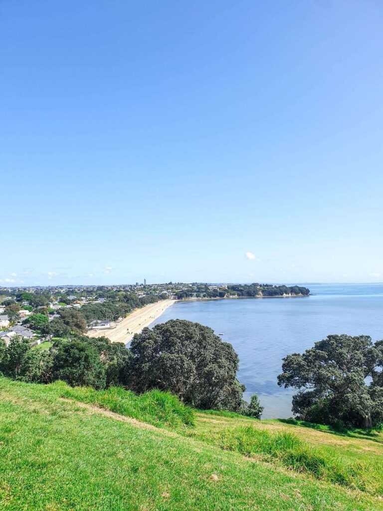 View from atop of a beach with blue waters during daytime