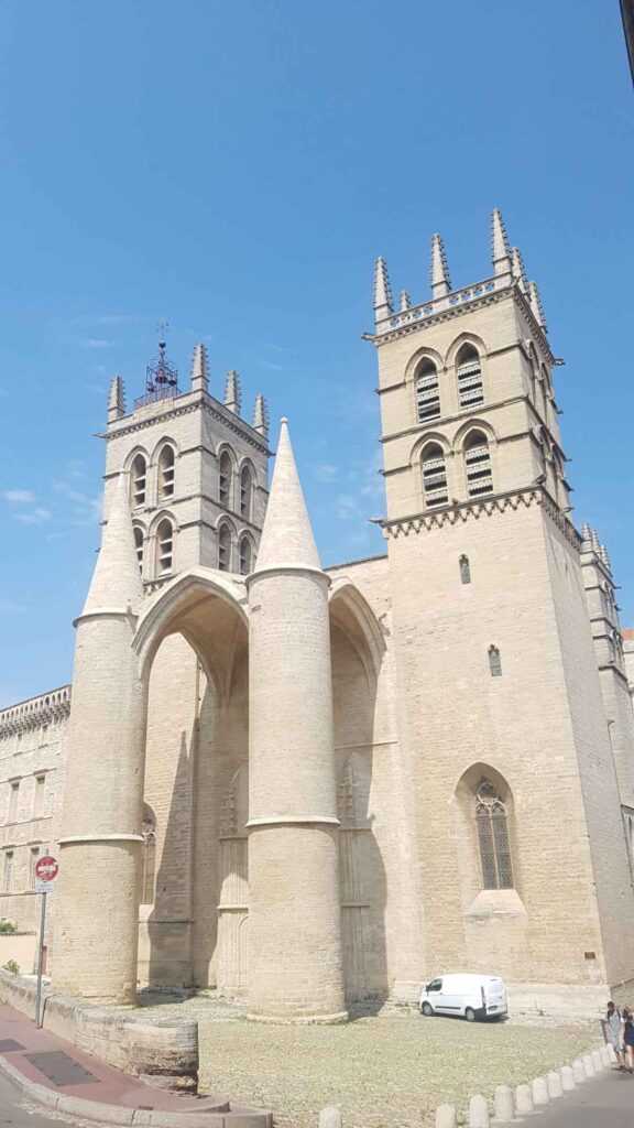 Tall white church structure during daytime