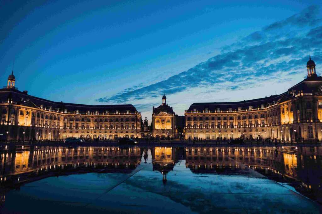 beautiful house like structure lit up during evening time