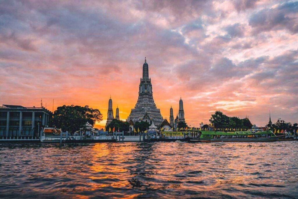 temple sitting near water during dusk