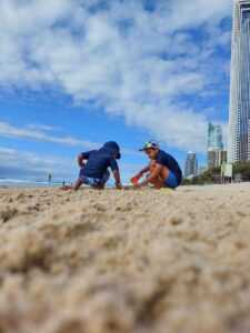 Two boys on a beach during daytime