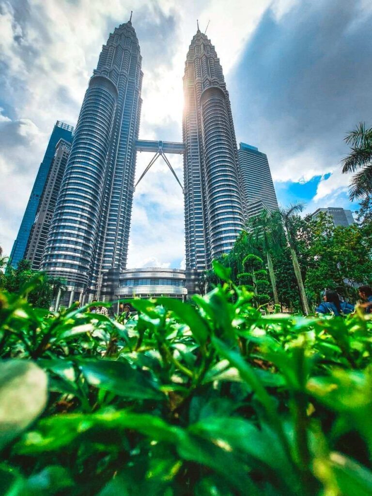 Large twin towers during daytime. Must visit place on this 5 day Kuala lumpur travel itinerary