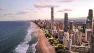 buildings along the coastline during sunset