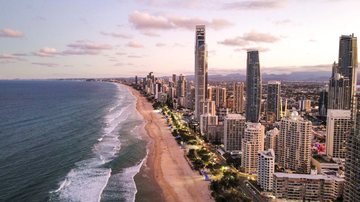 buildings along the coastline during sunset