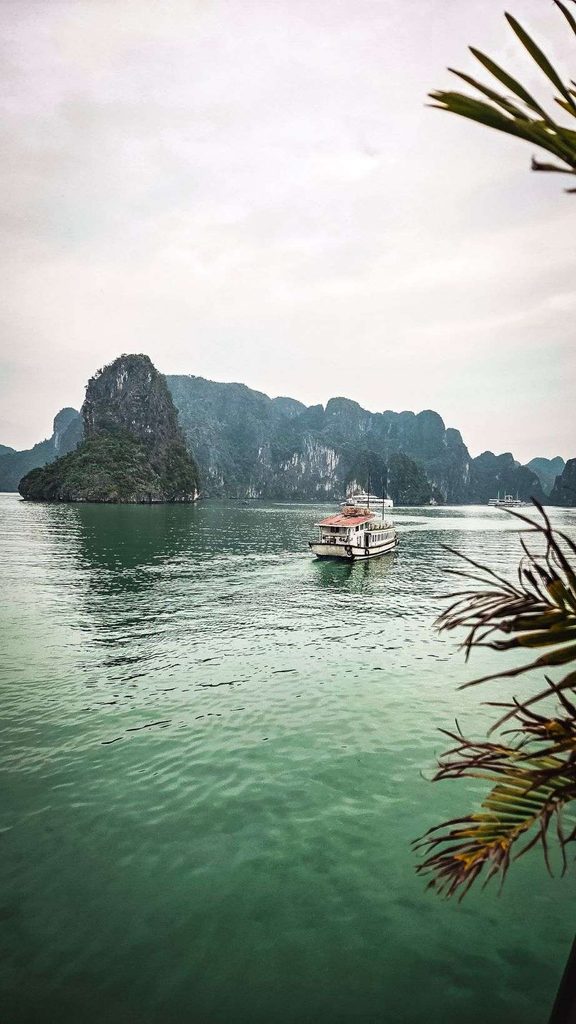 limestone cliffs in the ocean during day time